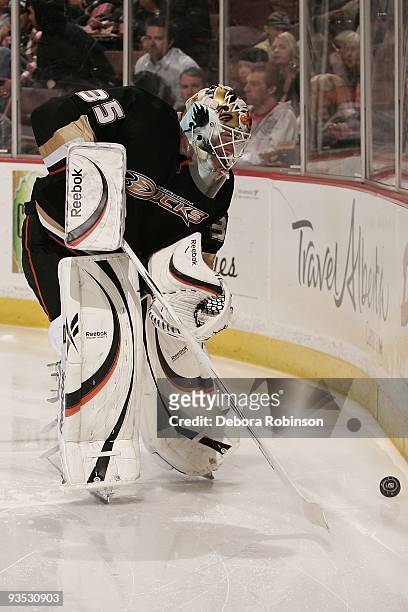 Jean-Sebastien Giguere of the Anaheim Ducks handles the puck behind the net during the game against the Phoenix Coyotes on November 29, 2009 at Honda...