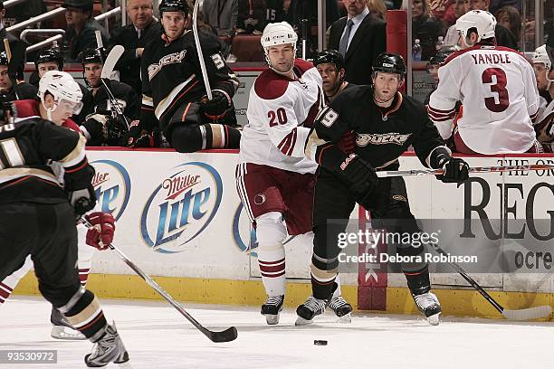 Robert Lang of the Phoenix Coyotes defends alongside the boards against Ryan Whitney of the Anaheim Ducks during the game on November 29, 2009 at...