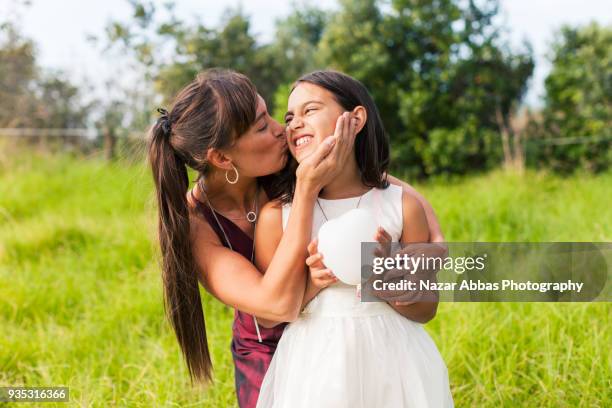 authentic bond between mother and daughter. - nazar abbas stock pictures, royalty-free photos & images