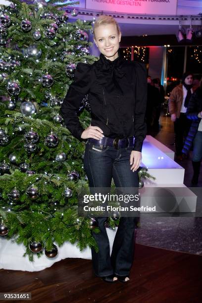 Model Franziska Knuppe poses in front of a christmas tree at the launch of the BMW art advent calendar 2009 at a BMW branch on December 1, 2009 in...