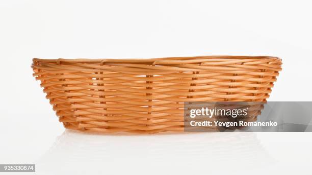 empty wooden wicker on white background - eggs basket stock pictures, royalty-free photos & images