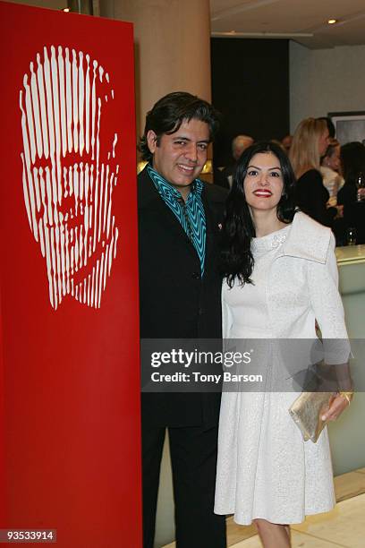 Artist Marcos Marin poses next to his piece of art to be auction during the Fight Aids Monaco Gala and Auction for at the Meridien Beach Plazza on...