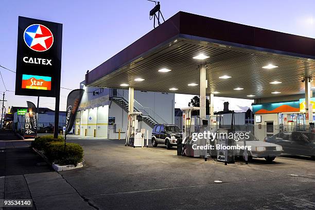 Customers refuel their cars at a Caltex Australia Ltd. Gas station in Melbourne, Australia, on Monday, Nov. 30, 2009. The Australian regulator is due...