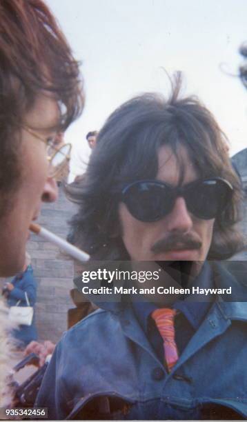 English musicians John Lennon and George Harrison of The Beatles during filming for surreal comedy television film 'Magical Mystery Tour' in Newquay,...