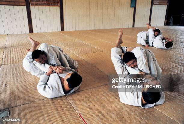 Men in the gym doing judo exercises, Japan.