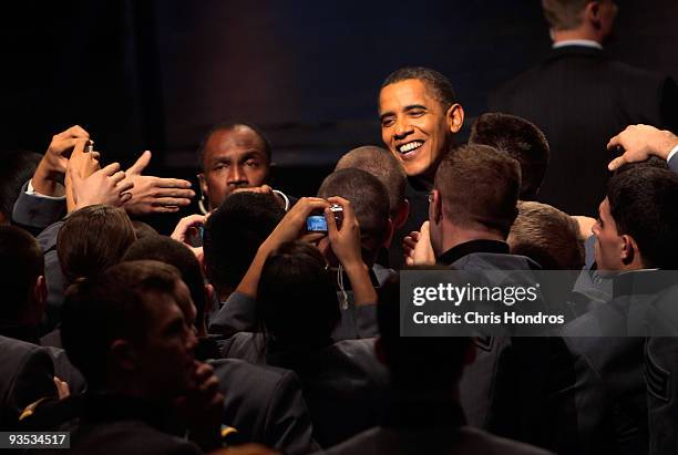 President Barack Obama shakes hands with cadets after speaking in Eisenhower Hall at the United States Military Academy at West Point December 1,...