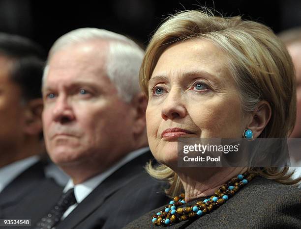 Secretary of State Hillary Rodham Clinton and Defense Secretary Robert Gates look on as U.S. President Barack Obama speaks in Eisenhower Hall at the...