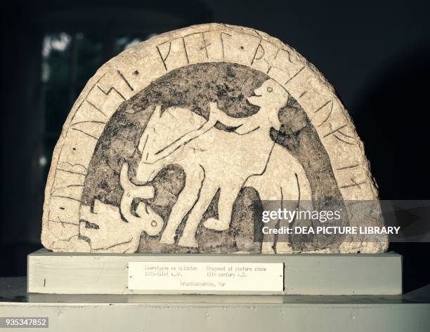 Rune stone depicting a man on horseback, with inscription. Viking civilisation, 11th century.