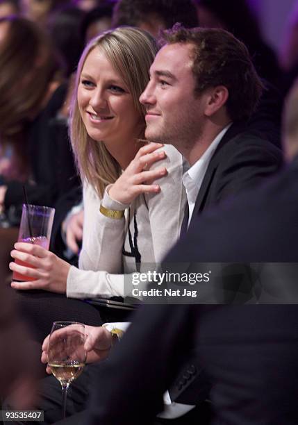 Television presenter Chloe Madeley and a guest attend the opening of the new Ed Hardy store at Westfield on December 1, 2009 in London, England.