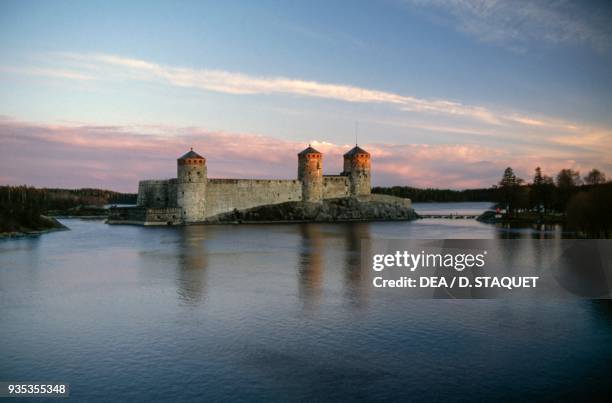 View of Olavinlinna castle at dusk Savonlinna, Finland, 15th century.