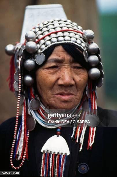 Akha woman wearing a traditional headdress, Thailand.