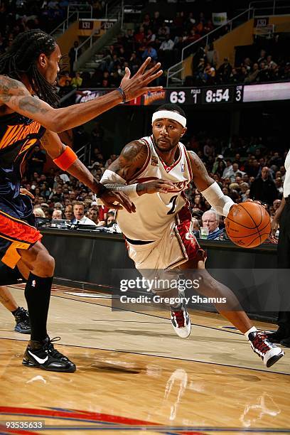 Mo Williams of the Cleveland Cavaliers drives against Mikki Moore of the Golden State Warriors during the game on November 17, 2009 at Quicken Loans...