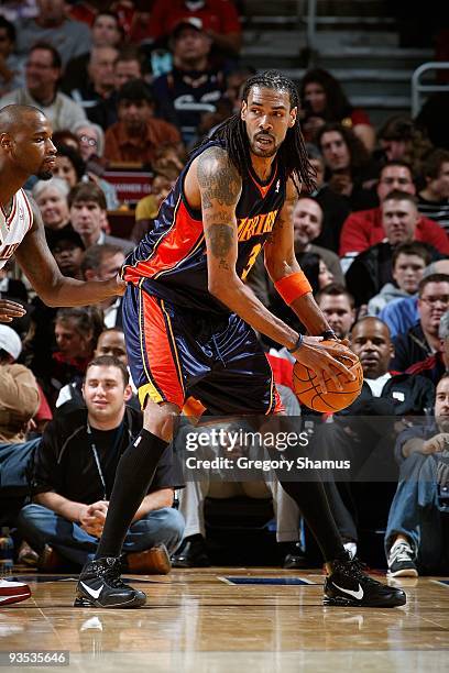 Mikki Moore of the Golden State Warriors handles the ball against Jawad Williams of the Cleveland Cavaliers during the game on November 17, 2009 at...