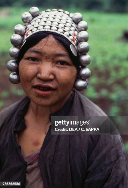 Akha woman wearing a traditional headdress, Thailand.