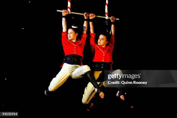 Caz Walsh and Hannah Cryle perform on the trapeze as graduates perform at the National Institute of Circus Arts on December 2, 2009 in Melbourne,...