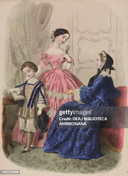 Boy wearing a smock and and loose short trousers, young woman wearing a ball gown, woman wearing a blue dress with wide sleeves, engraving by...