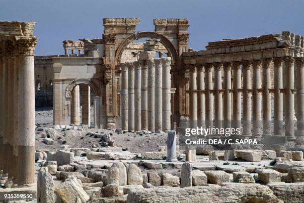 The triumphal arch of Septimius Severus and the main colonnaded street of Palmyra , near Tadmur, Syria. Roman civilisation, 1st-2nd century AD.