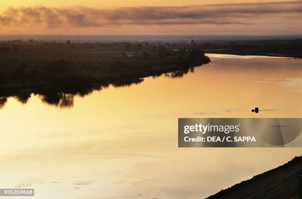 The Euphrates river at sunset near Deir ez-Zor, Syria.