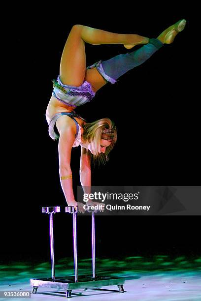 Jess Ward perform handstands on three canes as graduates perform at the National Institute of Circus Arts on December 2, 2009 in Melbourne, Australia.