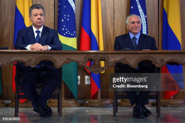 Michel Temer, Brazil's president, right, and Juan Manuel Santos, Colombia's president, sit during a joint press conference at the Planalto Palace in...