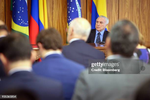 Michel Temer, Brazil's president, listens during a joint press conference with Juan Manuel Santos, Colombia's president, not pictured, at the...