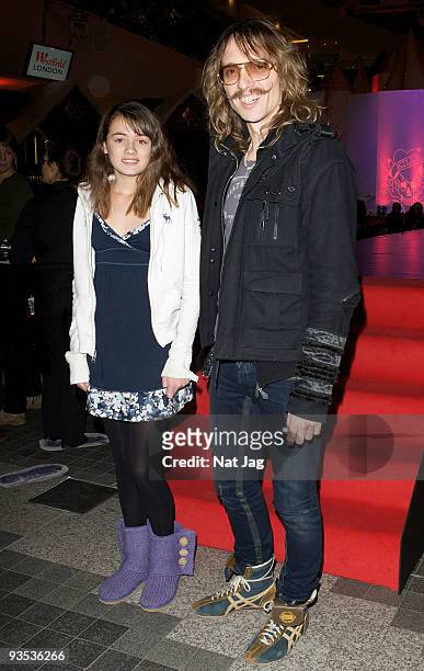 Musician Justin Hawkins and a guest attend the opening of the new Ed Hardy store at Westfield on December 1, 2009 in London, England.