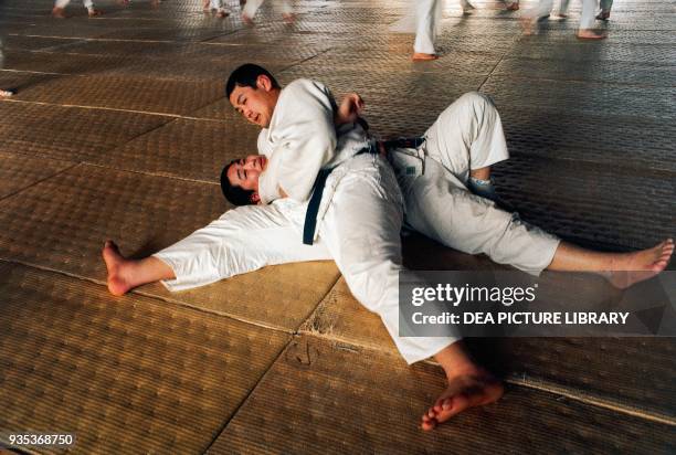 Men in the gym doing basic judo exercises, Tenri, Japan.