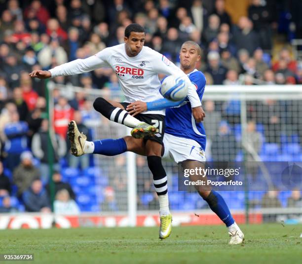 Scott Sinclair of Swansea City holds off Gianni Zuiverloon of Ipswich Town during the npower Championship match between Ipswich Town and Swansea City...