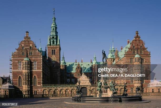 Glimpse of Kronborg Castle and the fountain , where Shakespeare set Hamlet, Elsinore, Denmark, 15th-17th century.