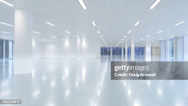 empty modern office floor space - illuminated corridor stock pictures, royalty-free photos & images