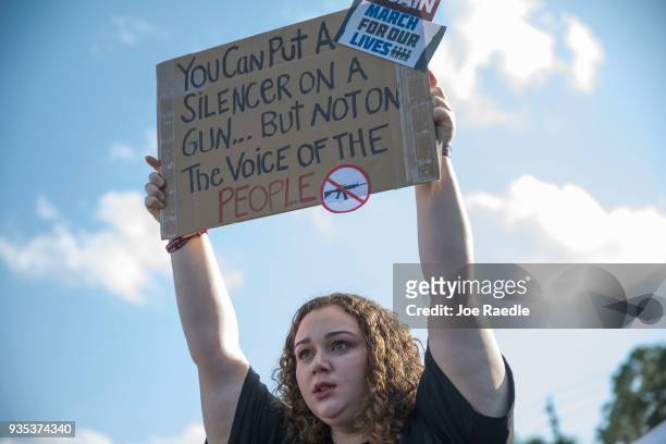 Sophie Phillips holds a sign as she attends a rally for those heading to the March for Our Lives event in Washington D.C. On March 20, 2018 in...