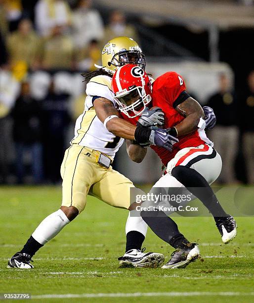 Morgan Burnett of the Georgia Tech Yellow Jackets against Caleb King of the Georgia Bulldogs at Bobby Dodd Stadium on November 28, 2009 in Atlanta,...