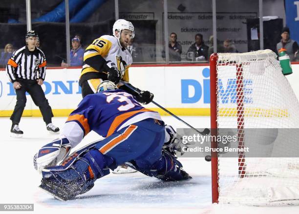 Christopher Gibson of the New York Islanders makes the first period stop on Riley Sheahan of the Pittsburgh Penguins at the Barclays Center on March...