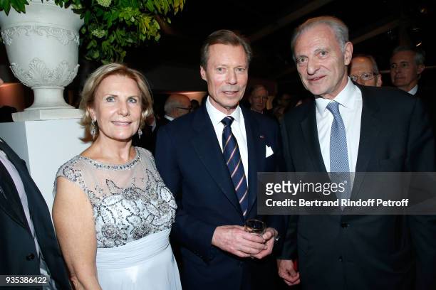 Grand-Duc Henri of Luxembourg standing betwen Alain Flammarion and his wife Suzanna attend the Reception given by LL.AA.RR. Grand-Duc Henri of...