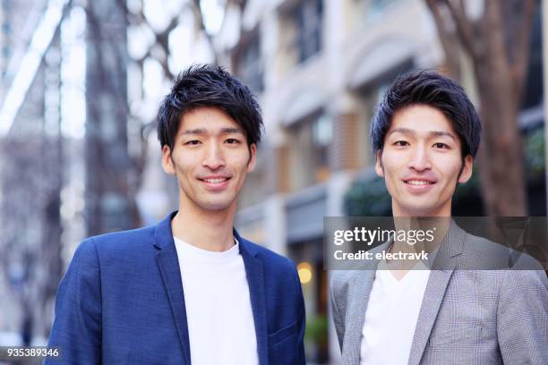 twin brothers - twin males stock pictures, royalty-free photos & images