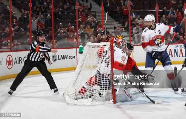 The puck bounces off the back of James Reimer of the Florida Panthers for a first period goal by Patrick Sieloff s, signaled by referee Kevin...