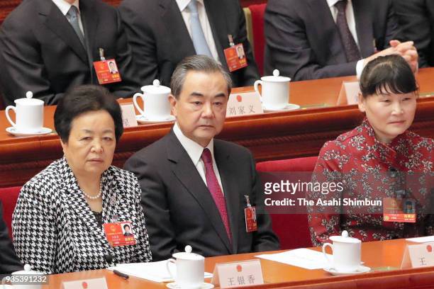 State Councilor Wang Yi attends the seventh plenary session of the 13th National People's Congress at the Great Hall of the People on March 19, 2018...