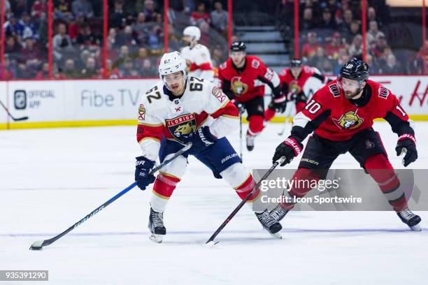 Florida Panthers Winger Denis Malgin skates the puck into the zone with Ottawa Senators Winger Tom Pyatt giving chase during first period National...