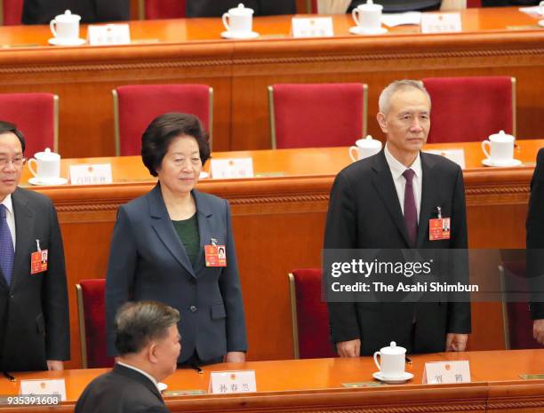 Newly elected Vice Premiers Sun Chunlan and Liu He swear an oath during the seventh plenary session of the 13th National People's Congress at the...