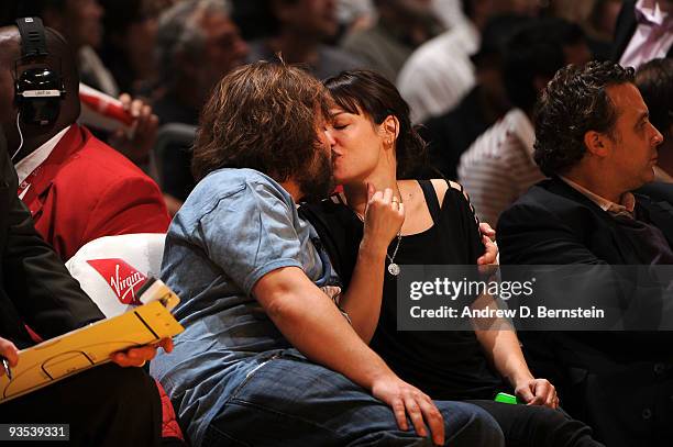 Actor Jack Black kisses his wife Tanya Hayden during a break in the action of a game between the New Orleans Hornets and the Los Angeles Lakers at...