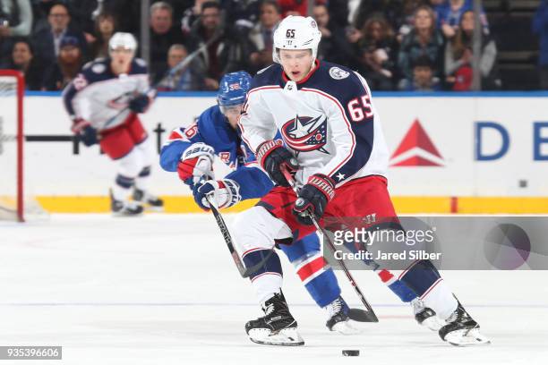 Markus Nutivaara of the Columbus Blue Jackets skates with the puck against Mats Zuccarello of the New York Rangers at Madison Square Garden on March...