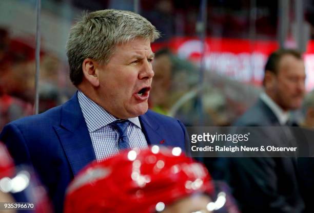 Carolina Hurricanes head coach Bill Peters directs the team during the first period against the Edmonton Oilers at PNC Arena in Raleigh, N.C., on...