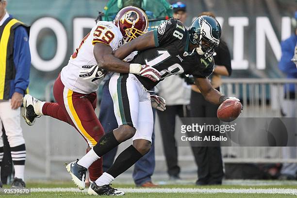 Jeremy Maclin of the Philadelphia Eagles makes a catch and is pushed out of bounds by London Fletcher of the Washington Redskins during their game at...