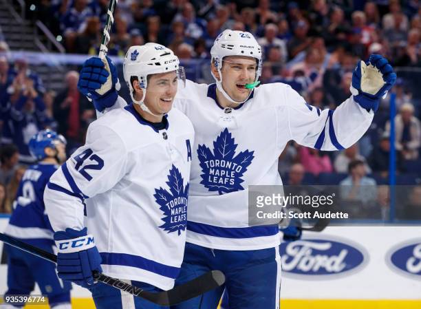 James van Riemsdyk of the Toronto Maple Leafs celebrates a goal with teammate Tyler Bozak against the Tampa Bay Lightning during the second period at...