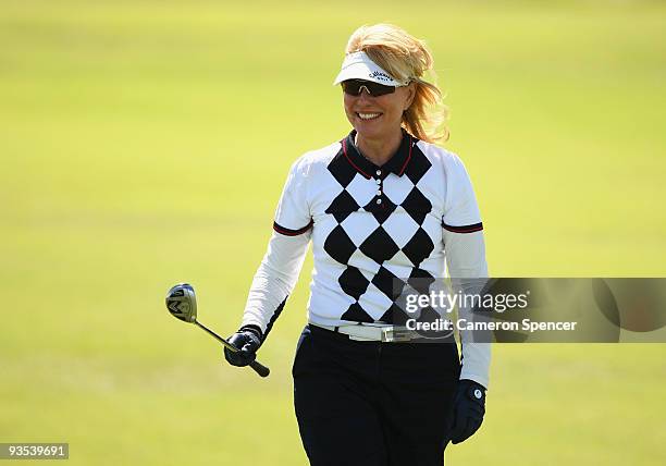 Television personality Kerri Anne Kennerley smiles after playing a shot during the pro-am ahead of the 2009 Australian Open Golf Championship at New...