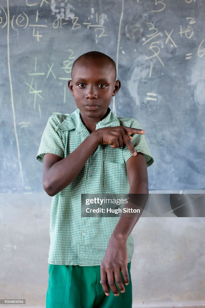 Deaf children learning sign language at school.