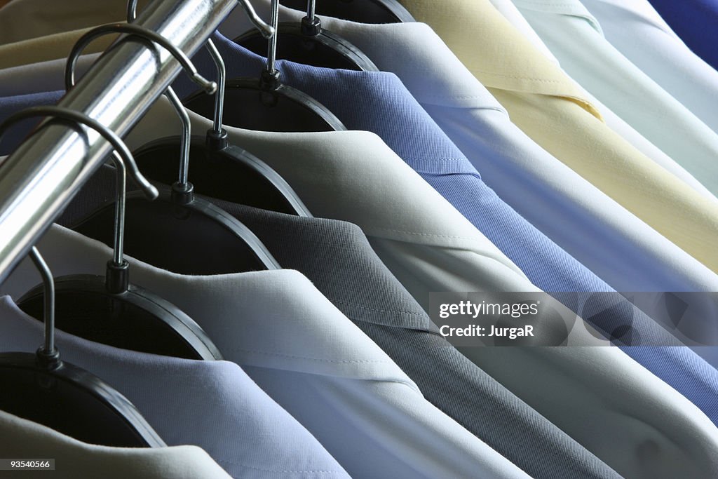 Shirts hanging on the rack - dry cleaner or laundry