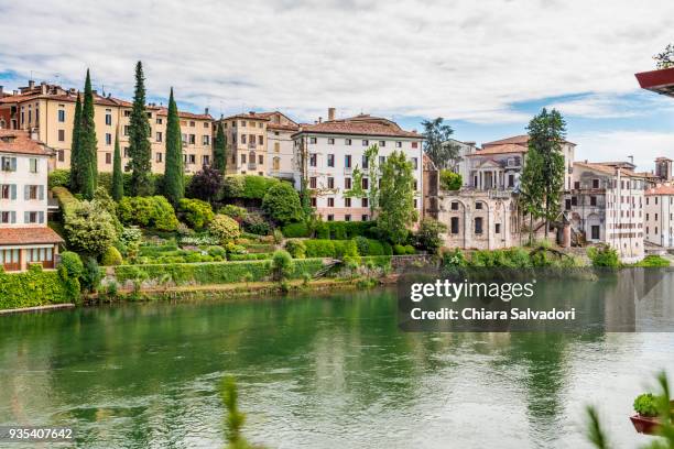 a view of bassano del grappa along the river brenta - bassano del grappa stock pictures, royalty-free photos & images