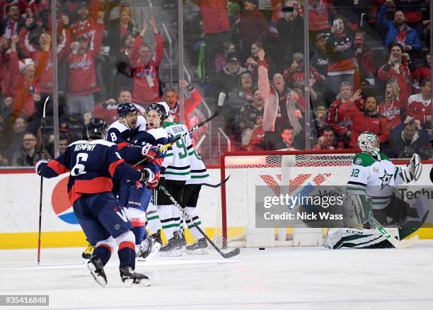 Alex Ovechkin of the Washington Capitals celebrates a goal by T.J. Oshie of the Washington Capitals against the Dallas Stars during the second period...