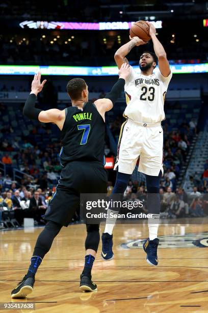 Anthony Davis of the New Orleans Pelicans shoots over Dwight Powell of the Dallas Mavericks during the first half at of a NBA game at the Smoothie...